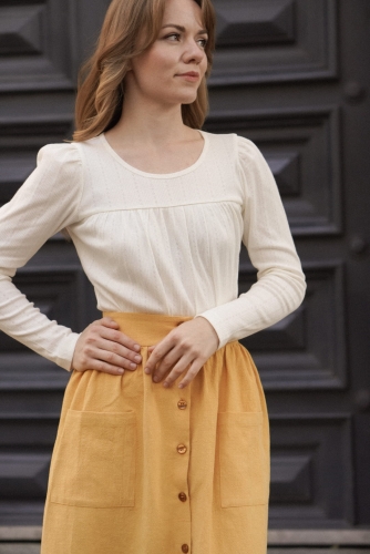 Kobieca spódnica z lnu w odcieniu żółtym, długość midi, fason rozkloszowany